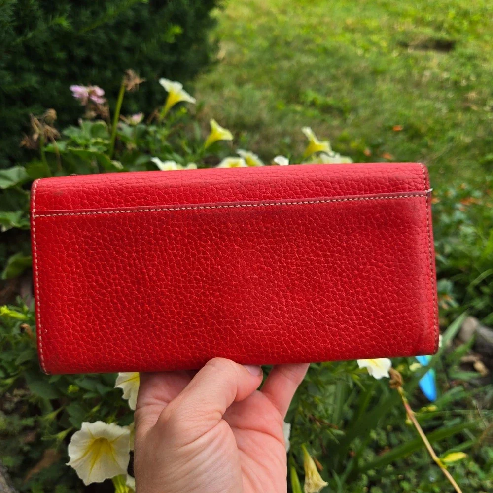 kate spade bifold pebble leather wallet. In red. Flaws